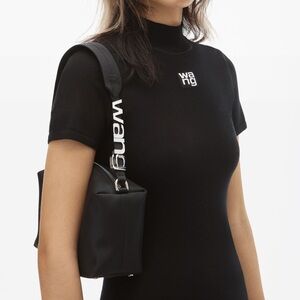 Alexander Wang black bag with silver logo detail.
